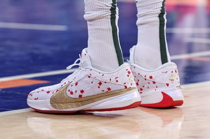 Milwaukee Bucks forward Giannis Antetokounmpo's white, red, and gold Nike sneakers.